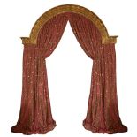 A PAIR OF GOLD AND RED COLOURED LEAF PATTERNED CURTAINS the shaped curtains approximately 3 metres