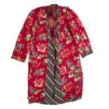 AN UZBECK SILK CHAPAN or cloak with printed floral design