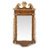 A GEORGE II MAHOGANY AND CARVED GILT WOOD WALL MIRROR or pier glass with swan neck pediment, central