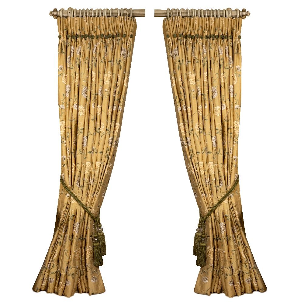 A PAIR OF GOLD GROUND INTERLINED CURTAINS decorated with green branches and yellow and gold flowers,