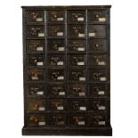 A LARGE PAINTED CHEST OF THIRTY TWO DRAWERS each with stencilled numerals and bolt head handles