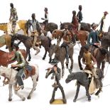 A GROUP OF FOURTEEN SOUTH AMERICAN PAPIER MACHE HORSES and riders and a further figure of a man, the