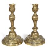 A PAIR OF 18TH CENTURY STYLE CONTINENTAL CAST BRASS CANDLESTICKS in the Rococo manner, 14cm wide x
