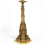 A 19TH CENTURY CONTINENTAL BRASS OIL LAMP BASE decorated with winged beasts, cast foliate banding,