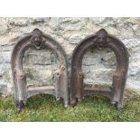 A PAIR OF VICTORIAN CAST IRON BOOT SCRAPERS each arching scraper surmounted by a Gothic mask and