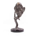 A DALI STYLE CAST BRONZE depicting a face and hand on a circular hardstone base, 32cm wide