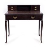 AN EDWARDIAN MAHOGANY WRITING DESK with cabriole legs, 90cm wide x 52.5cm deep x 91cm high