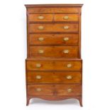 A GEORGE III MAHOGANY CHEST ON CHEST with an inlaid shaped cornice, two short and six long drawers