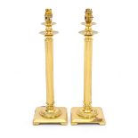 A PAIR OF BRASS TABLE LAMPS with reeded columns and square bases, each 45cm high (2)