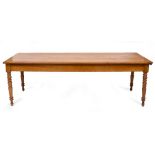 AN ANTIQUE FRUITWOOD RECTANGULAR KITCHEN TABLE with a single drawer to one end and turned legs,