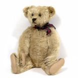 AN EARLY 20TH CENTURY, POSSIBLY 1907, STEIFF BEAR blonde mohair with script button to right ear,