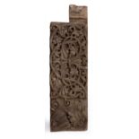 AN EASTERN CARVED WOODEN BLOCK carved in relief with stylised scrolling foliage, 58cm long