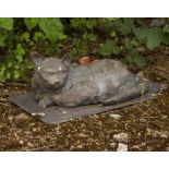 A LATE 20TH CENTURY BRONZED RESIN SCULPTURE OF A CAT on slate base, indistinctly signed to the