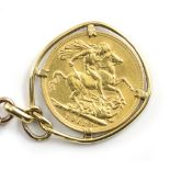 A VICTORIAN 9 CARAT GOLD CHAIN with a sovereign suspended from a unmarked yellow metal mount, the