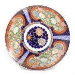 A LATE 19TH / EARLY 20TH CENTURY JAPANESE CHARGER with Imari colour palette decorated with scrolling