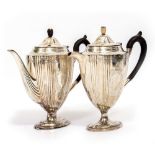 A WALKER & HALL SILVER COFFEE POT with ebony finial in the form of a pineapple, chased and