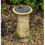 A COMPOSITE STONE SUNDIAL BASE with metal gnomen, unmarked and a bronzed metal model of a bird (2)