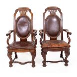 A PAIR OF LATE VICTORIAN OAK SIDE CHAIRS with scrolling cresting rails, overstuffed upholstered