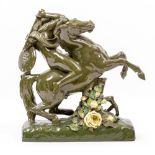 A VICTORIAN GREEN GLAZED POTTERY FIGURE of a female warrior on horseback, 41cm long x 40cm high