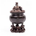 A CHINESE BRONZE CENSOR on three short legs, together with a fitted carved stand and lid, 11.5cm