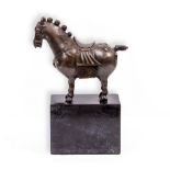 A BRONZE STATUE in the form of a Chinese horse, mounted on a black marble base, overall 20cm wide