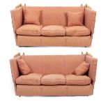 A PAIR OF CONTEMPORARY KNOWLE DROP ARM BROCADE UPHOLSTERED SOFAS of gold pattern on a coral ground,