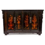 A CHINESE DARK STAINED SIDE CABINET with two pairs of cupboard doors painted with foliage, 157.5cm