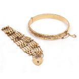 A 9 CARAT YELLOW GOLD BANGLE with engraved decoration, a 9 carat gold gate bracelet, overall
