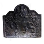 A CAST IRON FIRE BACK with arching top and decorated with a lion, 75cm wide x 65cm high