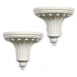 A PAIR OF WHITE PAINTED COMPOSITE UPLIGHTERS in the form of half round fluted architectural