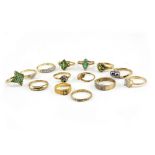 A COLLECTION OF DRESS RINGS to include a black pearl twist ring, green paste stone diamond chip