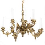 A FRENCH ORMOLU TWO TIER TWELVE LIGHT CHANDELIER or electrolier, the scrolling branches cast with