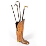 AN EARLY 20TH CENTURY BOOT STICK STAND 58cm high and sticks therein to include a horn handled