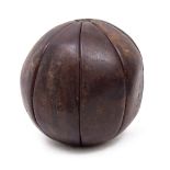 AN OLD MEDICINE BALL 27cm x 29cm