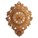 A CONTINENTAL CARVED OAK WALL CLOCK with leaf and scroll decoration, enamel numerals and later