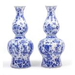 A PAIR OF BLUE AND WHITE DUTCH DELFT VASES of octagonal tapering form, each 34cm in height