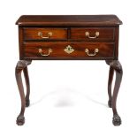 A GEORGE III STYLE MAHOGANY LOW BOY with three drawers and cabriole legs terminating in ball and