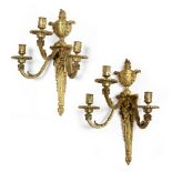 A PAIR OF 19TH CENTURY ORMOLU CANDLE SCONCES each with three arms of classical form, each surmounted