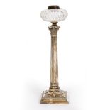 A 19TH CENTURY SILVER PLATED OIL LAMP BASE of fluted classical column form with cut glass reservoir,