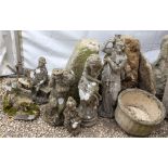 A QUANTITY OF GARDEN ORNAMENTS to include two staddle stones, two composite urns, a bird bath etc