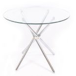 A CONTEMPORARY CIRCULAR GLASS TOPPED TABLE with a crowed base, the top 92cm wide