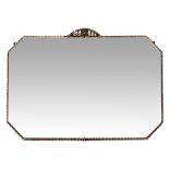 AN OCTAGONAL WALL MIRROR with a metal frame and bevelled edge, 75cm x 49cm