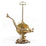 AN EASTERN ADJUSTABLE BRASS OIL LAMP of serpent form, 37cm wide x 44cm high