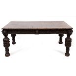 A 19TH CENTURY CARVED OAK DINING TABLE with lion's mask mounts and turned supports, 171cm long x