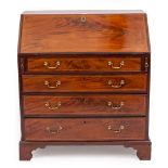 A GEORGE III FLAME MAHOGANY INLAID BUREAU with drop fall front, standing on bracket feet, 91cm