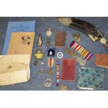 A SELECTION OF MILITARIA to include World War II service medals, The African Star, various tunic and