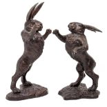 A LARGE PAIR OF BRONZE BOXING HARES the largest 84cm high (2)