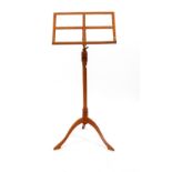 A TURNED HARDWOOD ADJUSTABLE MUSIC STAND on a tripod base, 99cm high (adjustable)