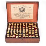 AN OLD WOODEN BOX containing used shotgun shells,