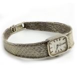 A VINTAGE OMEGA LADIES WRIST WATCH on 9 carat white gold bracelet strap, 18.5 grams approximately in